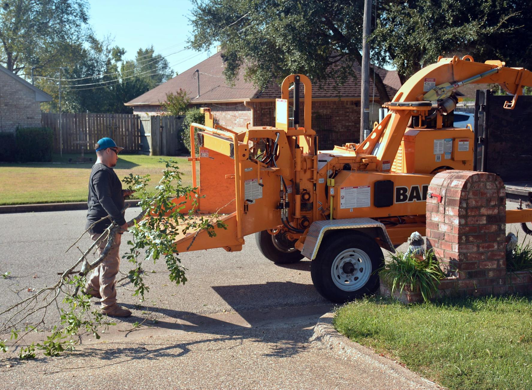Wood chipper processing tree debris
